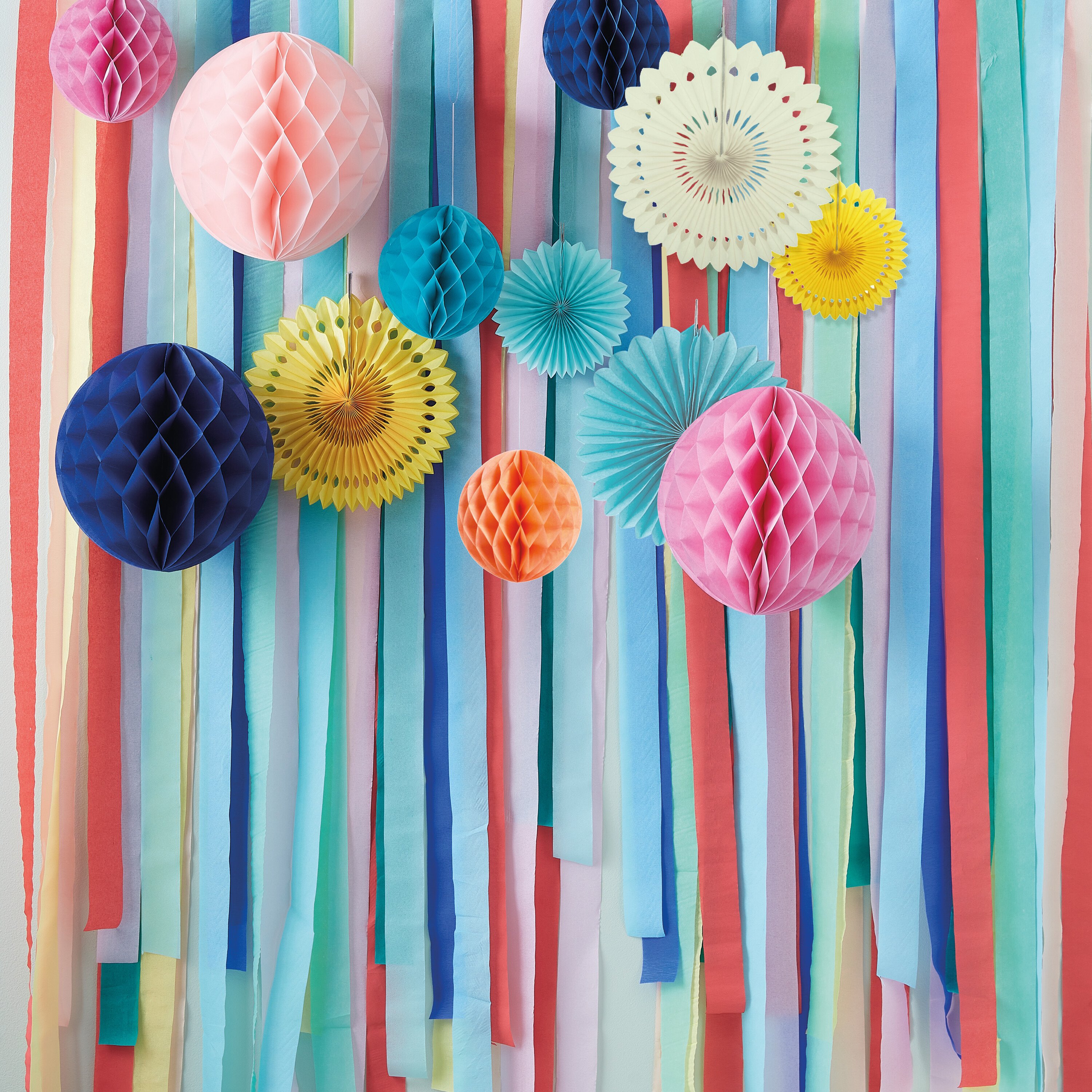 Multicoloured Streamer Backdrop with Honeycombs and Fans | Ginger Ray